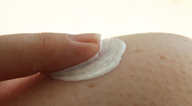 Lotion being applied to dry skin